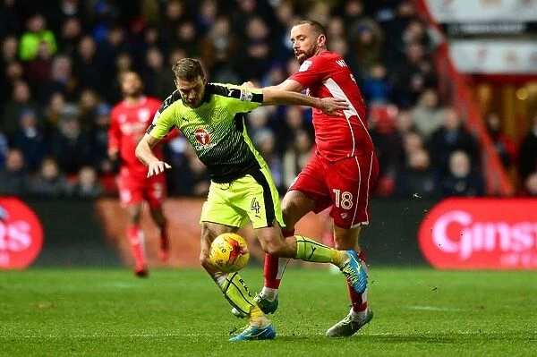 Bristol City vs Reading: Intense Battle for the Ball between Aaron Wilbraham and Joey van den Berg