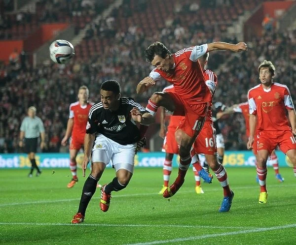 Bristol City vs Southampton: Intense Header Battle Between Derrick Williams and Jack Cork