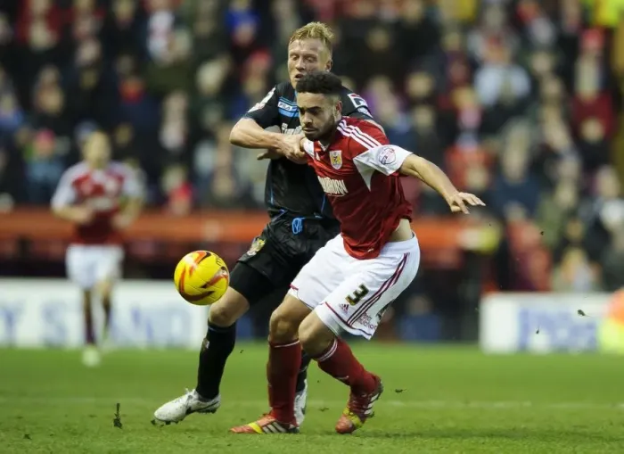 Framed Print : Bristol City vs Stevenage: Intense Moment as Derrick Williams and Jordan Burrow Clash in Sky Bet League One Match