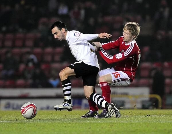 Bristol City vs Swansea City: Intense Battle for Possession between Leon Britton and Andy Keogh (Championship Football Match, 01 / 02 / 2011)