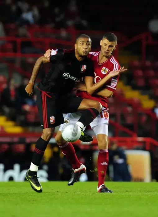 Framed Print : Bristol City vs Swindon Town: James Wilson Clashes in League Cup Match at Ashton Gate Stadium (August 2011) Framed Print : Bristol City vs Swindon Town: James Wilson Clashes in League Cup Match at Ashton Gate Stadium (August 2011)