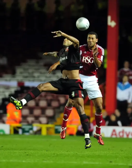 Framed Print : Bristol City vs Swindon Town: Lewin Nyatanga vs Leon Clarke in Intense League Cup Clash at Ashton Gate Stadium (August 2011) Framed Print : Bristol City vs Swindon Town: Lewin Nyatanga vs Leon Clarke in Intense League Cup Clash at Ashton Gate Stadium (August 2011)