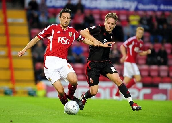 Bristol City vs Swindon Town: Cole Skuse vs Simon Ferry Battle in League Cup Match, August 2011 - Football
