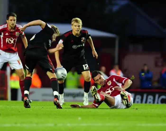 Framed Print : Bristol City vs Swindon Town: Jamie McAllister vs Simon Ferry Battle in League Cup Match, August 2011