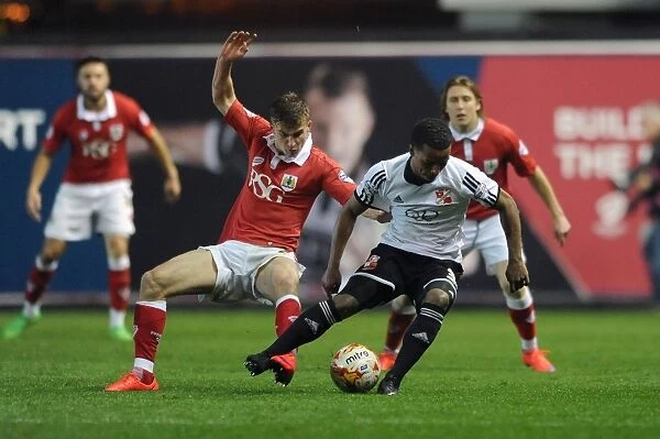 Bristol City vs Swindon Town: Joe Bryan and Nathan Byrne in Heated Battle for the Ball