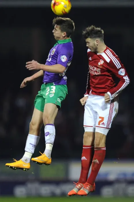 Framed Print : Bristol City vs Swindon Town: Joe Bryan vs Ben Gladwin Heading Battle