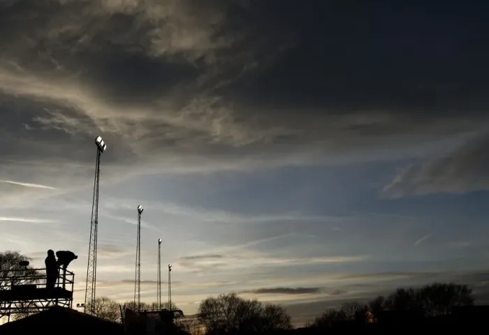 Framed Print : Bristol City vs. Tamworth: Sunset Showdown at The Lamb Ground - ITV Cameraman and Illuminated Floodlights