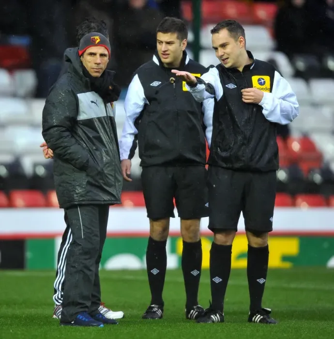 Framed Print : Bristol City vs. Watford: Managers Derek McInnes and Gianfranco Zola Discuss with Referee Before Game's Postponement Framed Print : Bristol City vs. Watford: Managers Derek McInnes and Gianfranco Zola Discuss with Referee Before Game's Postponement