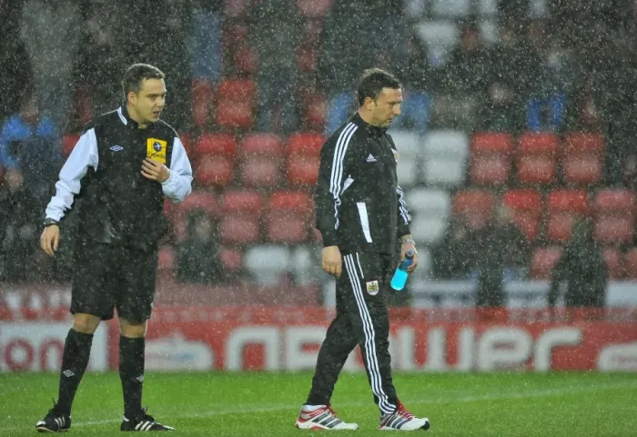 Framed Print : Bristol City vs. Watford: Derek McInnes Discusses with Referee Michael Naylor Before Game Postponement (December 2012)