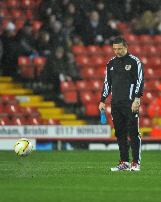 Framed Print : Bristol City vs. Watford: Derek McInnes Examines the Pitch Before Referees Call Off Championship Match (December 2012)