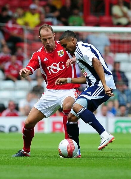Bristol City vs. West Brom: A Battle for the Ball - Louis Carey vs. Jerome Thomas, Championship Match, 2011