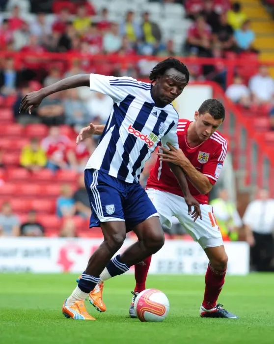 Framed Print : Bristol City vs. West Brom: Intense Battle Between James Wilson and Somen Tchoyi in Championship Match, 2011 Framed Print : Bristol City vs. West Brom: Intense Battle Between James Wilson and Somen Tchoyi in Championship Match, 2011