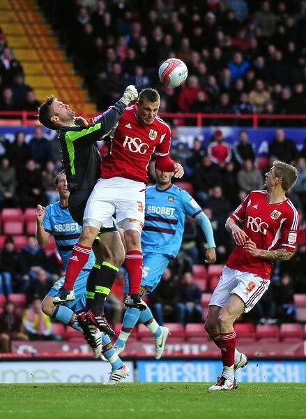Bristol City vs West Ham: Chris Wood Fights for Ball over Robert Green