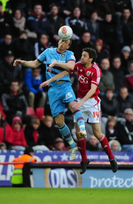 Framed Print : Bristol City vs. West Ham: Cole Skuse vs. Danny Collins Battle for High Ball at Ashton Gate Stadium