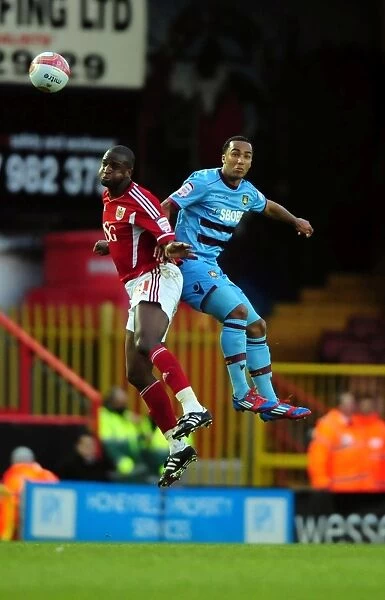 Bristol City vs. West Ham: Intense Aerial Battle Between Kalifa Cisse and Nicky Maynard