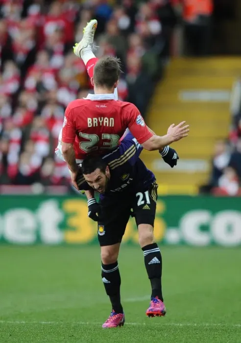 Framed Print : Bristol City vs West Ham United: Joe Bryan Fouled by Amalfitano in FA Cup Clash Framed Print : Bristol City vs West Ham United: Joe Bryan Fouled by Amalfitano in FA Cup Clash