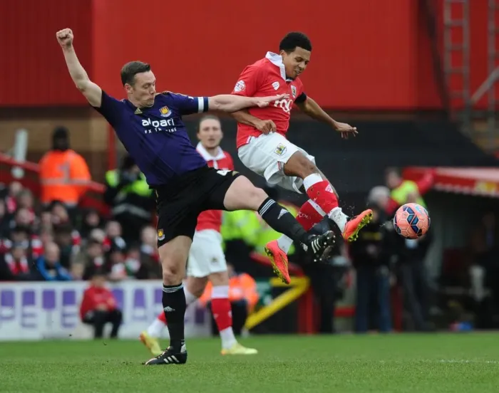 Framed Print : Bristol City vs. West Ham United: Korey Smith vs. Kevin Nolan - Intense Battle on the Pitch