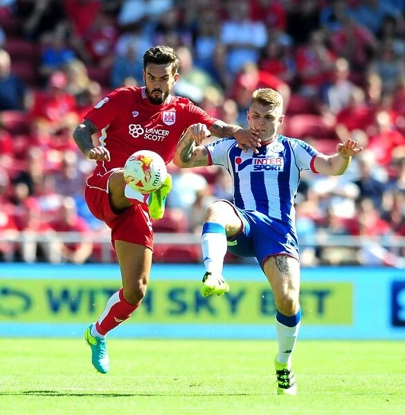 Bristol City vs Wigan Athletic: Marlon Pack and Max Power Battle for Ball in Sky Bet Championship Match