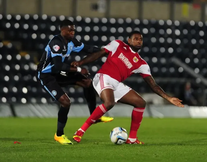 Framed Print : Bristol City vs Wycombe Wanderers: Intense Football Rivalry in the Johnstone's Paint Trophy Clash at Adams Park (October 8, 2013)