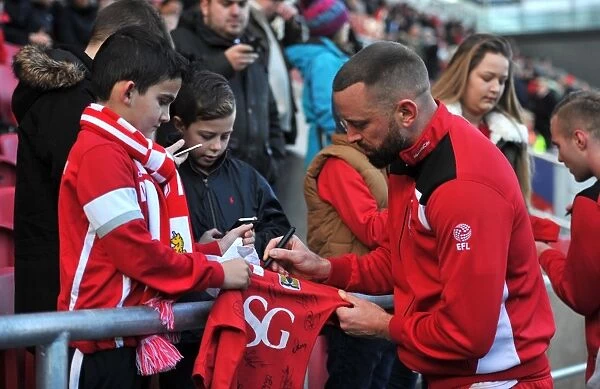 Bristol City's Aaron Wilbraham Signs Fan's Shirt during Bristol City v Cardiff City Match, Sky Bet Championship (January 14, 2017)