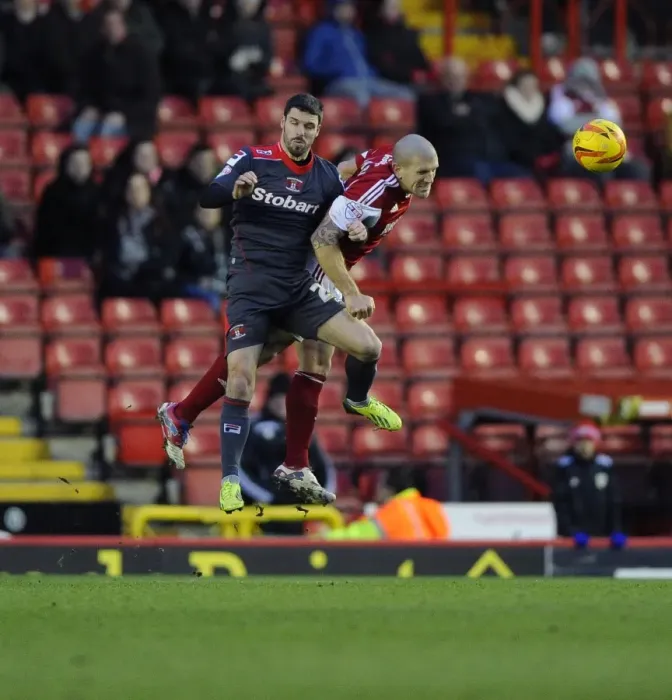 Framed Print : Bristol City's Adam El-Abd Fights for Aerial Supremacy in Sky Bet League One Clash Against Carlisle United Framed Print : Bristol City's Adam El-Abd Fights for Aerial Supremacy in Sky Bet League One Clash Against Carlisle United