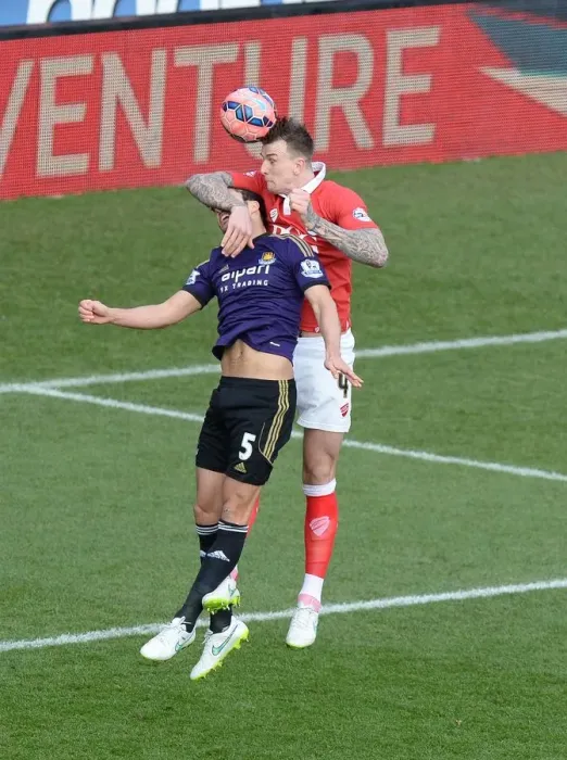 Framed Print : Bristol City's Aden Flint Outjumps West Ham's James Tomkins for a Powerful Aerial Battle