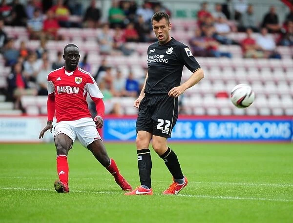 Bristol City's Albert Adomah Crosses the Ball in Pre-Season Clash vs Bournemouth