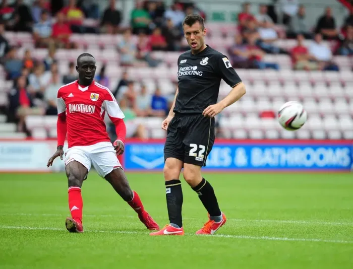 Framed Print : Bristol City's Albert Adomah Crosses the Ball in Pre-Season Clash vs Bournemouth Framed Print : Bristol City's Albert Adomah Crosses the Ball in Pre-Season Clash vs Bournemouth