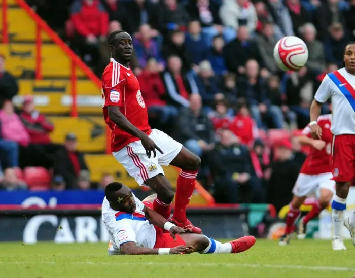 Framed Print : Bristol City's Albert Adomah Foul by Claude Davis in Championship Match at Ashton Gate Stadium (December 2010)