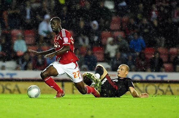 Bristol City's Albert Adomah Foul by Swindon Town's Alan McCormack - League Cup Clash (August 2011)