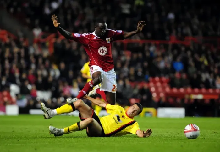 Framed Print : Bristol City's Albert Adomah Fouled by Don Cowie in Championship Match against Watford (14.09.2010) Framed Print : Bristol City's Albert Adomah Fouled by Don Cowie in Championship Match against Watford (14.09.2010)
