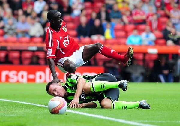 Bristol City's Albert Adomah Fouled by Marcos Painter in Championship Match against Brighton (10-09-2011)
