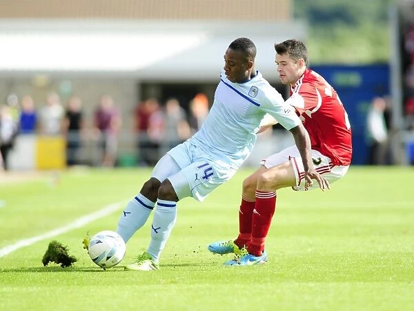 Bristol City's Brendan Moloney Closes In on Coventry's Franck Moussa in Sky Bet League One Clash