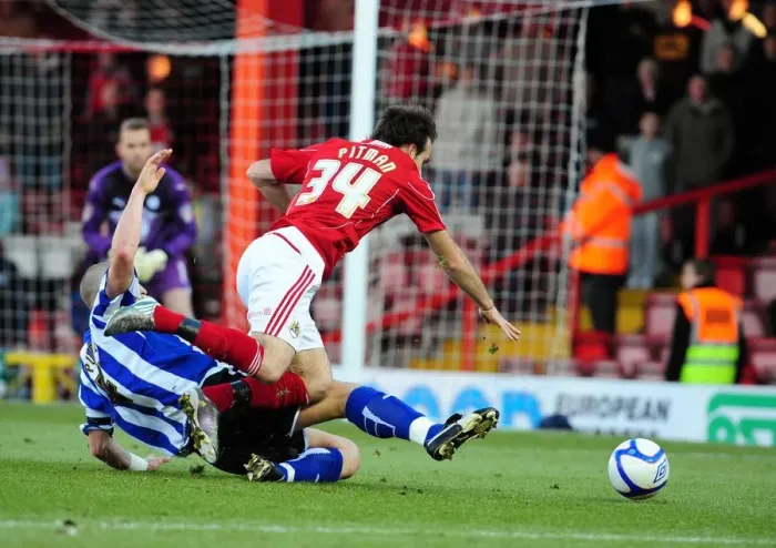Framed Print : Bristol City's Brett Pitman Foul by Darren Purse in FA Cup Match vs Sheffield Wednesday Framed Print : Bristol City's Brett Pitman Foul by Darren Purse in FA Cup Match vs Sheffield Wednesday