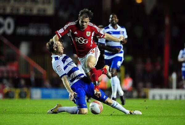 Bristol City's Brett Pitman Fouled by Kaspars Gorkss in Championship Match against Reading (September 27, 2011)
