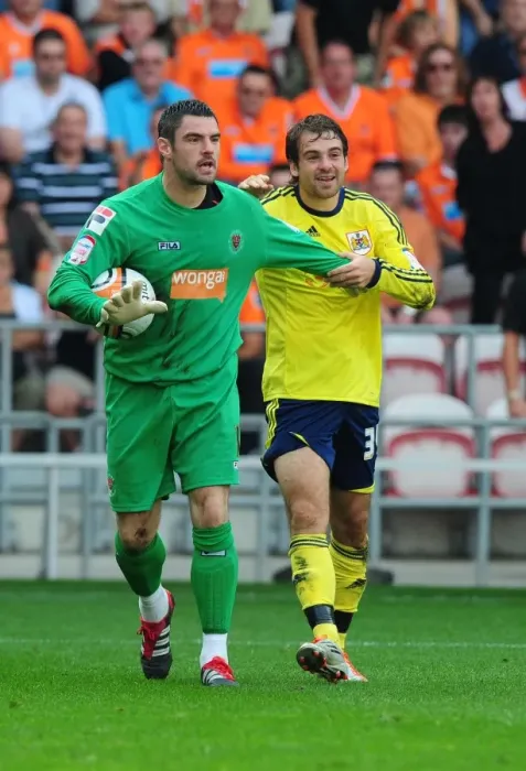 Framed Print : Bristol City's Brett Pitman Slips Against Blackpool's Matthew Gilks - League Cup Match, 01 / 10 / 2011 Framed Print : Bristol City's Brett Pitman Slips Against Blackpool's Matthew Gilks - League Cup Match, 01 / 10 / 2011