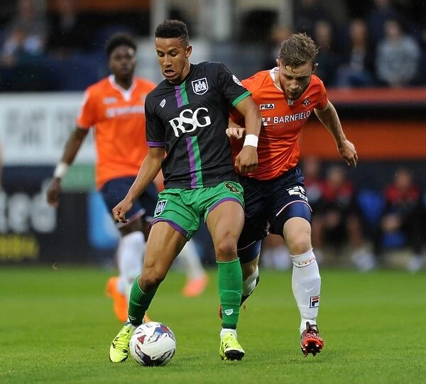 Bristol City's Callum Robinson Battles for the Ball against Luton Town's Mark O'Brien - Capital One Cup First Round, 2015