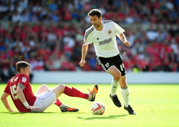 Bristol City's Cole Skuse Dribbles Past Nottingham Forest's Greg Halford in Championship Clash