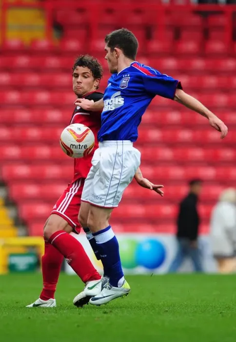 Framed Print : Bristol City's Curtis Jones Tackles Ipswich Town's Bryan Lawrence in Intense U21s Clash