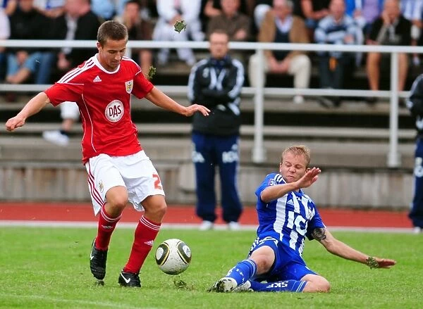 Bristol Citys Danny Ball battles for the ball