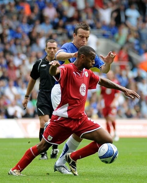 Bristol City`s Danny Haynes and Cardiff`s Gavin Rae battle for possession