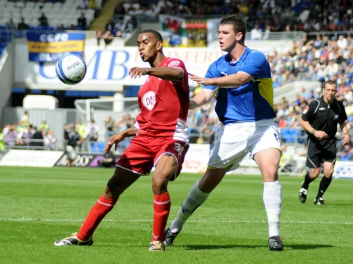 Framed Print : Bristol City`s Danny Haynes is closely marked by Cardiffs Tony Gerrard