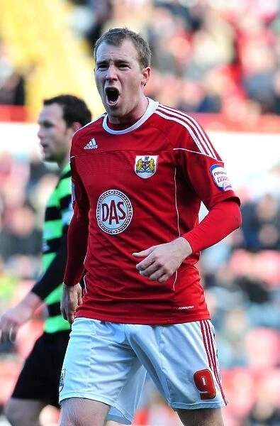 Bristol City's David Clarkson Euphorically Celebrates Goal Against Scunthorpe United in Championship Match (2010)