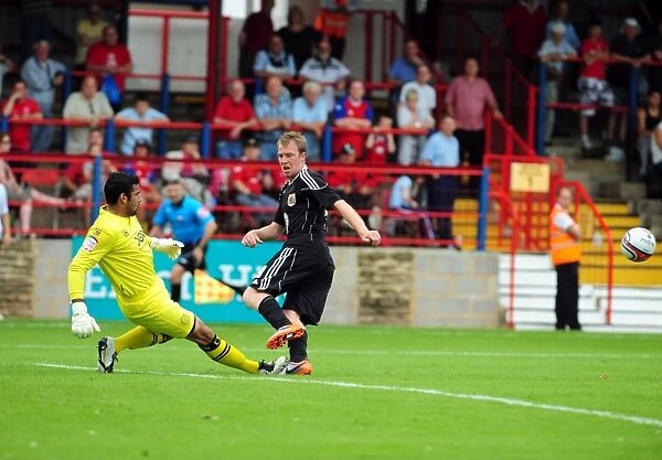 Bristol Citys David Clarkson sees his shot saved by Aldershots Jamie Young
