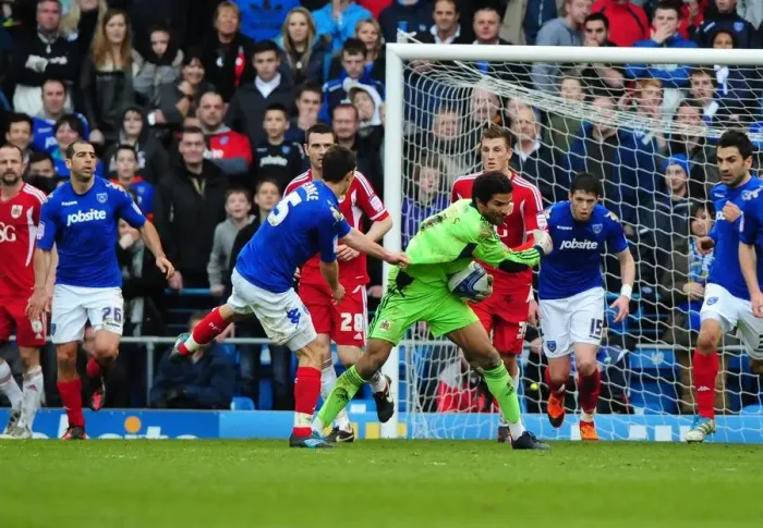 Framed Print : Bristol City's David James Foulied by Portsmouth's Jason Pearce During Football Match Framed Print : Bristol City's David James Foulied by Portsmouth's Jason Pearce During Football Match
