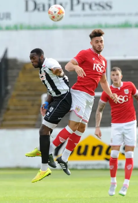 Framed Print : Bristol City's Derrick Williams Battles for a Header in Pre-Season Friendly against Bath City Framed Print : Bristol City's Derrick Williams Battles for a Header in Pre-Season Friendly against Bath City