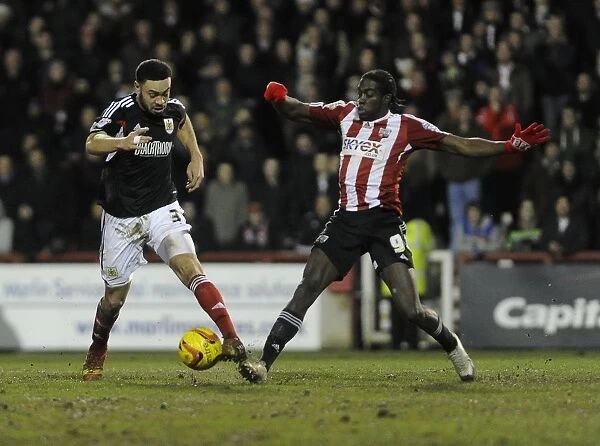 Bristol City's Derrick Williams and Brentford's Clayton Donaldson Battle for the Ball in Sky Bet League One Clash at Griffin Park, January 2014