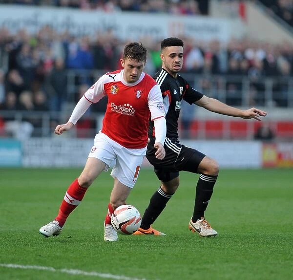 Bristol City's Derrick Williams Closes In on Rotherham United's Lee Frecklington in Sky Bet League One Clash