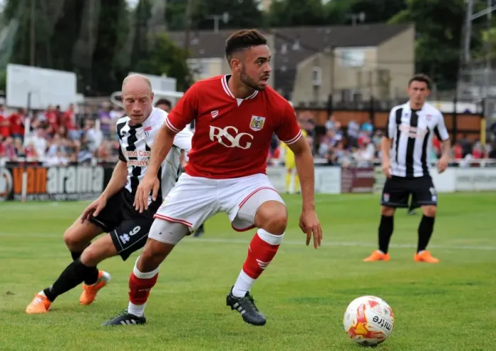 Framed Print : Bristol City's Derrick Williams Faces Off Against Bath City's Dave Pratt in Pre-Season Friendly Clash Framed Print : Bristol City's Derrick Williams Faces Off Against Bath City's Dave Pratt in Pre-Season Friendly Clash