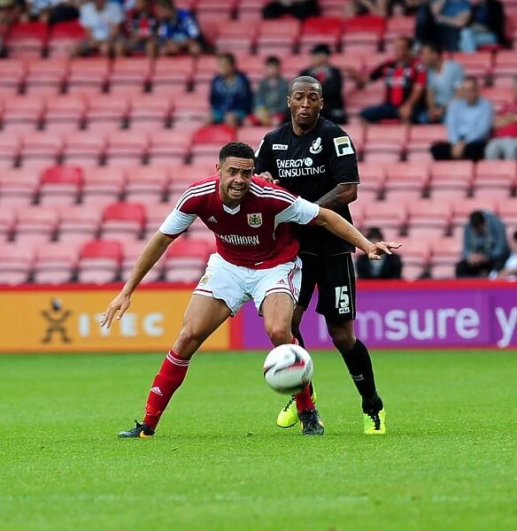 Bristol City's Derrick Williams Secures Ball from Wes Thomas in Pre-Season Clash at Bournemouth, 2013